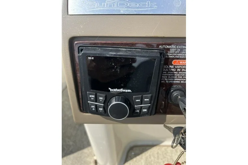 Slide: The Image of Control panel of a 2010 Sea Ray 260 Sundeck boat with Rockford Fosgate audio system. - 21