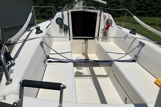 Slide: The Image of 1984 S2 6.9 sailboat cockpit with ropes and open cabin entrance. - 4