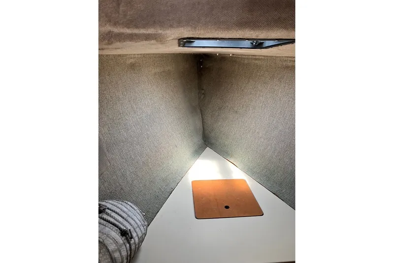 Slide: The Image of Interior cabin space of a 1984 S2 6.9 sailboat with carpeted walls. - 9