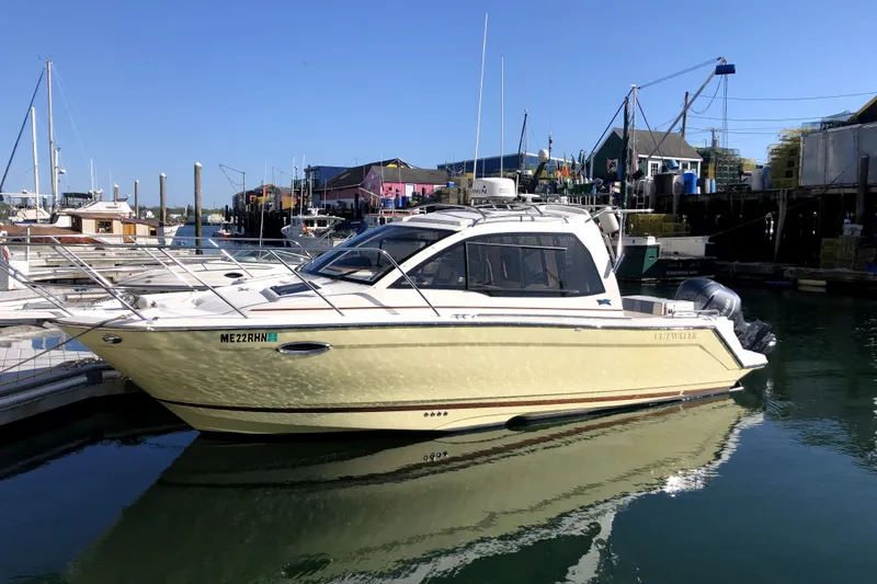 The Image of 2018 Cutwater C-24 boat docked in a marina under clear blue skies. - 1