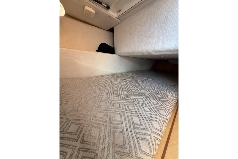 Slide: The Image of Interior cabin of 2018 Cutwater C-24 boat with patterned upholstery. - 7