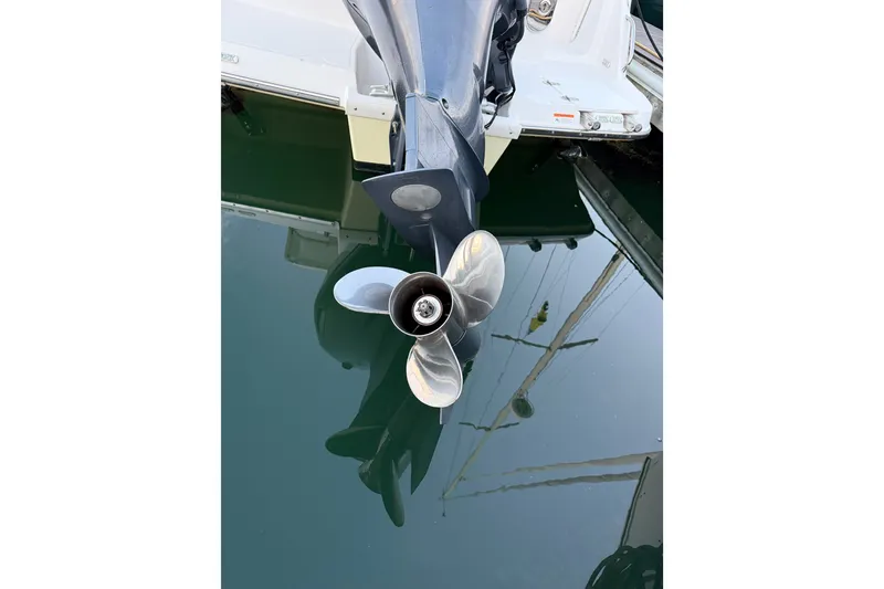 Slide: The Image of 2018 Cutwater C-24 boat propeller reflecting in calm water. - 13