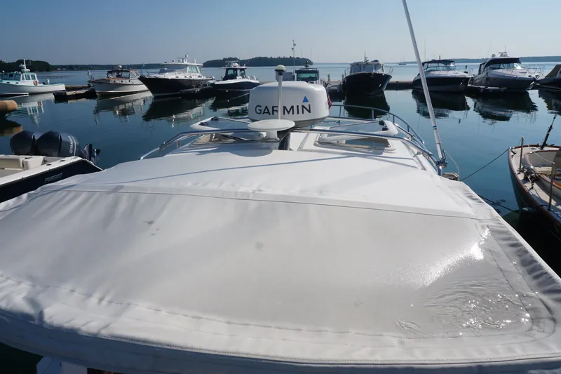 Slide: The Image of 2018 Cutwater C-24 boat docked in a marina, featuring Garmin equipment. - 39