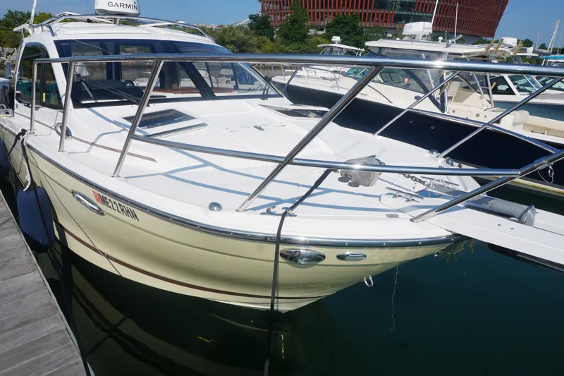Slide: The Image of 2018 Cutwater C-24 boat docked at marina, featuring sleek design and modern equipment. - 17