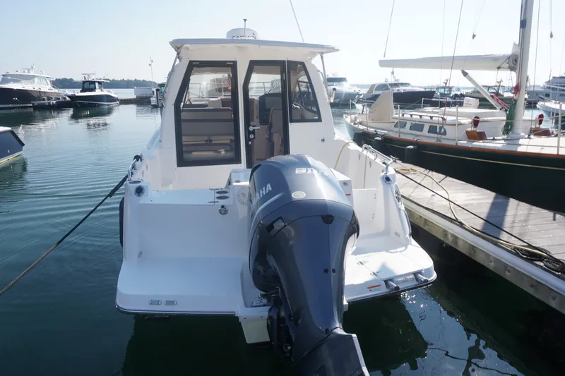 Slide: The Image of 2018 Cutwater C-24 boat docked with Yamaha outboard motor in marina. - 42