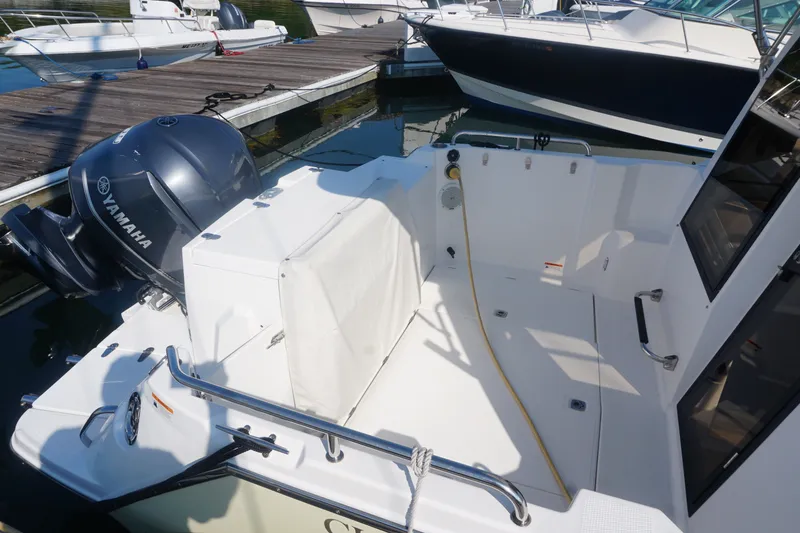 Slide: The Image of 2018 Cutwater C-24 boat with Yamaha engine docked at marina. - 21