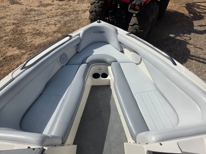 Slide: The Image of The image shows the bow of a 2003 MasterCraft X-30 boat with gray upholstery. - 6
