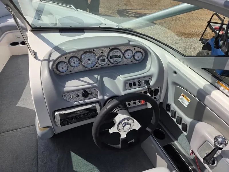 Slide: The Image of The image shows the cockpit of a 2003 MasterCraft X-30 with a modern dashboard. - 7