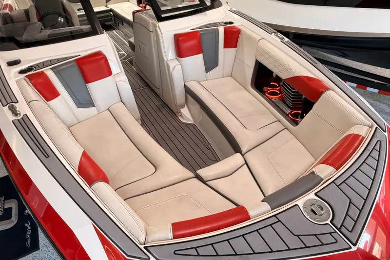 Slide: The Image of Luxurious interior of 2019 Nautique Super Air Nautique G25 with red and beige seating. - 16