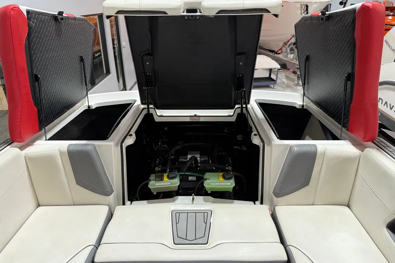 Slide: The Image of 2019 Nautique Super Air Nautique G25 engine compartment with open hatches and seating. - 24