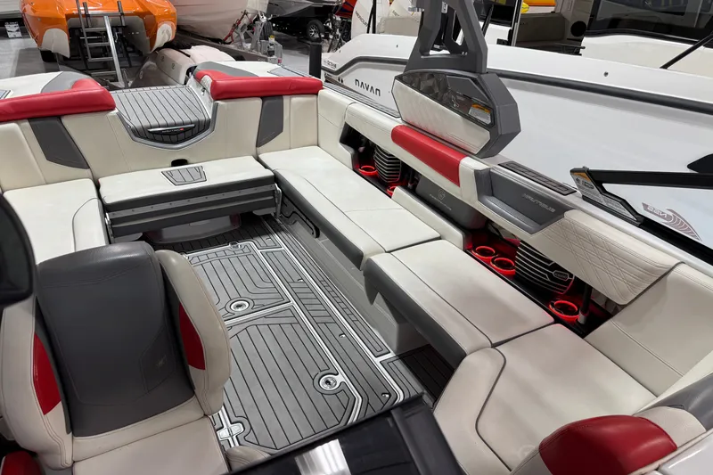 Slide: The Image of Luxurious interior of 2019 Nautique Super Air Nautique G25 boat with red and white seating. - 27