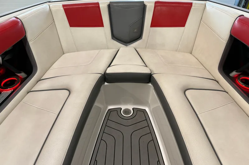 Slide: The Image of Interior of 2019 Nautique Super Air Nautique G25 with red and beige seating. - 43