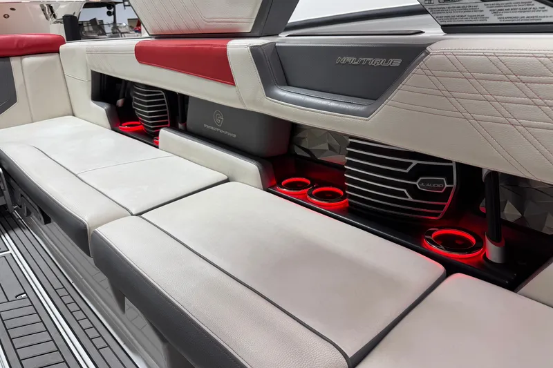 Slide: The Image of 2019 Nautique Super Air Nautique G25 interior with red LED lighting and premium seating. - 28