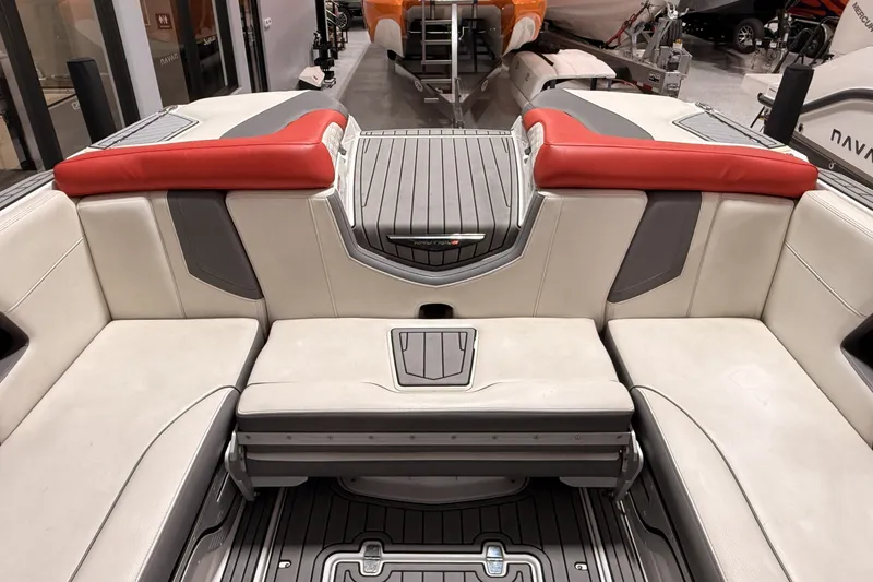 Slide: The Image of 2019 Nautique Super Air Nautique G25 interior with red and gray seating. - 20