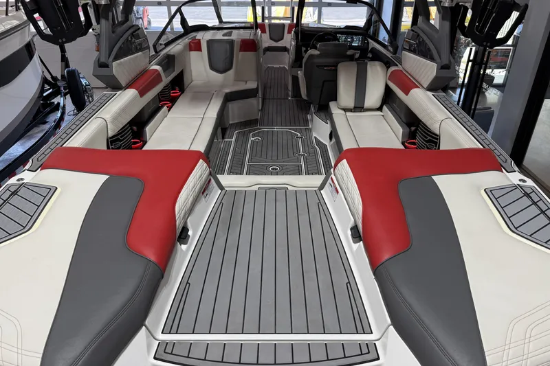 Slide: The Image of 2019 Nautique Super Air Nautique G25 interior with red, gray, and white seating. - 34