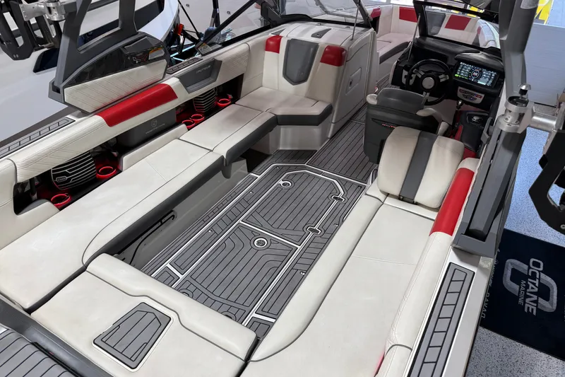 Slide: The Image of 2019 Nautique Super Air Nautique G25 interior with red accents and advanced dashboard. - 36
