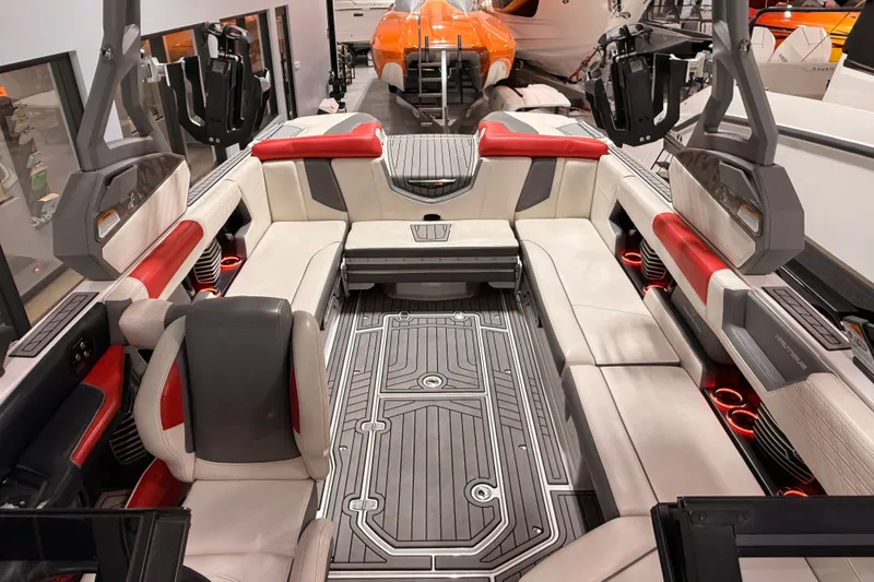 Slide: The Image of 2019 Nautique Super Air Nautique G25 interior with red and white seating, modern design. - 18