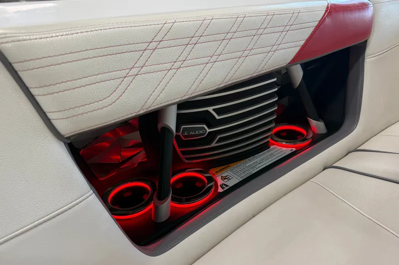 Slide: The Image of Interior of 2019 Nautique Super Air Nautique G25 with JL Audio system and red LED lighting. - 45