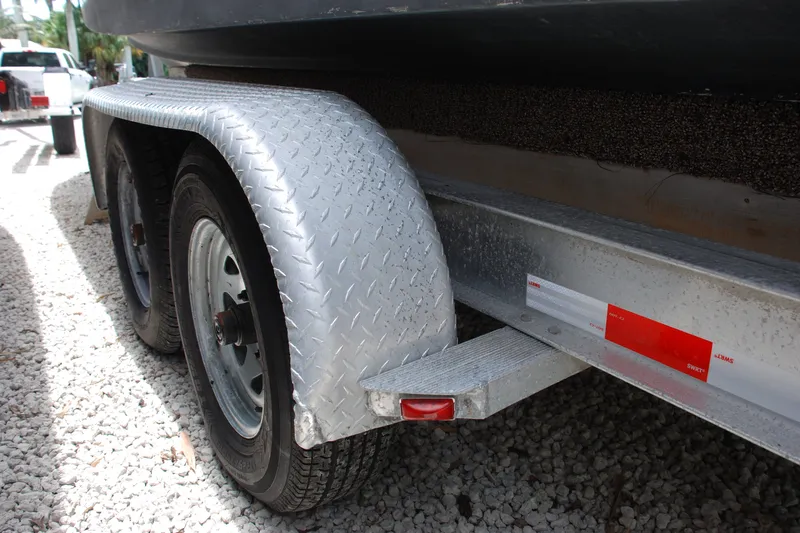 Slide: The Image of Trailer for 2003 Grady-White Chase 273 boat on gravel surface. - 26