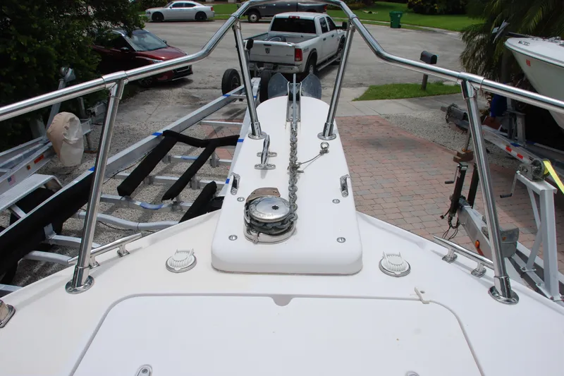 Slide: The Image of Bow view of 2003 Grady-White Chase 273 boat on trailer, featuring anchor and railings. - 8