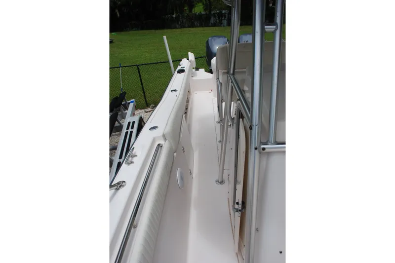 Slide: The Image of 2003 Grady-White Chase 273 boat deck with railing and seating area. - 5