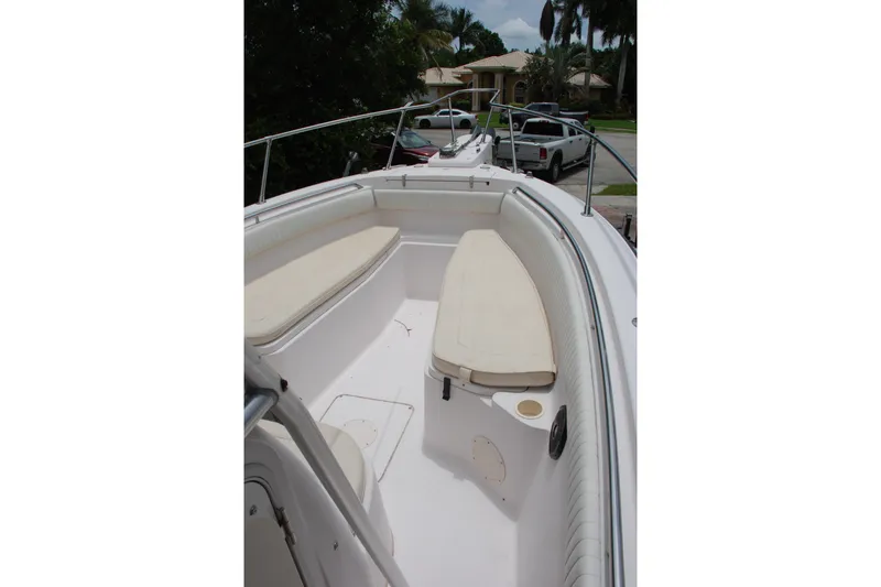Slide: The Image of 2003 Grady-White Chase 273 boat interior with cushioned seating and railing. - 9