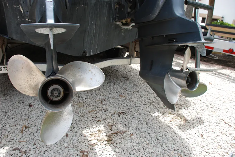 Slide: The Image of Propellers of a 2003 Grady-White Chase 273 boat on gravel surface. - 20