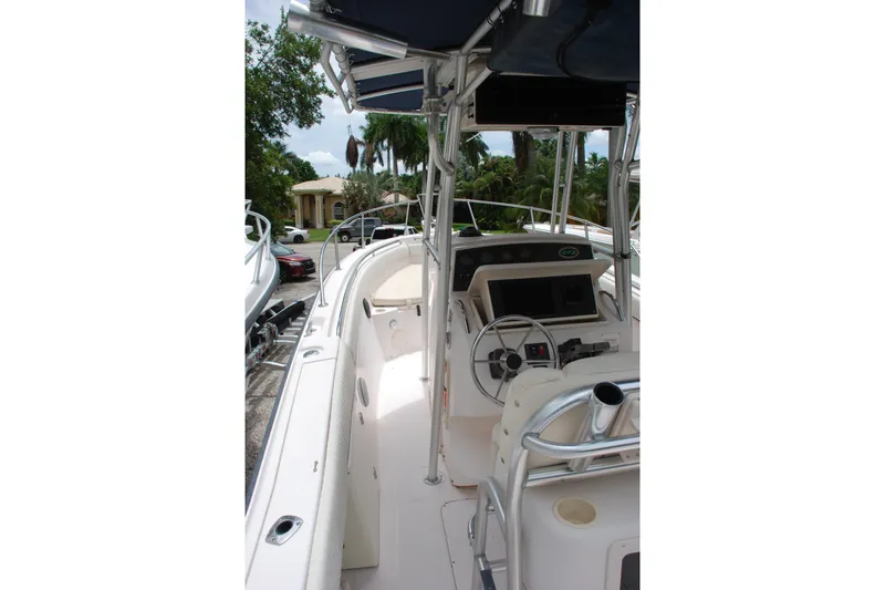 Slide: The Image of 2003 Grady-White Chase 273 boat interior with steering console and seating. - 14