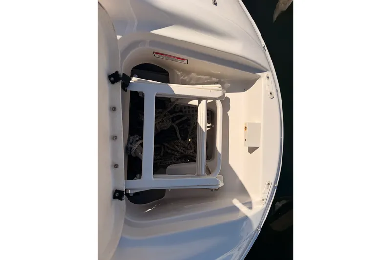 Slide: The Image of 2005 Sea Ray 240 Sundeck boat ladder and storage compartment detail. - 20
