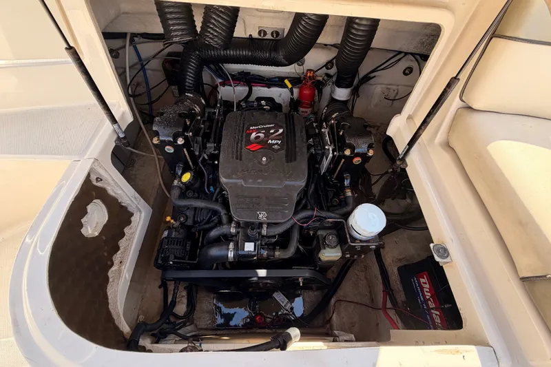 Slide: The Image of The engine compartment of a 2005 Sea Ray 240 Sundeck with a 6.2 MPI engine is visible. - 27