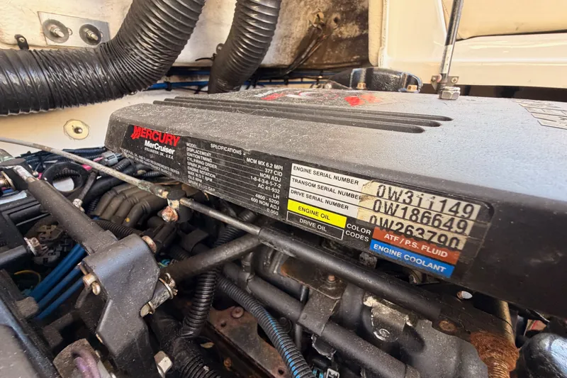 Slide: The Image of Mercury MerCruiser engine in a 2005 Sea Ray 240 Sundeck boat, showing serial numbers and specifications. - 29