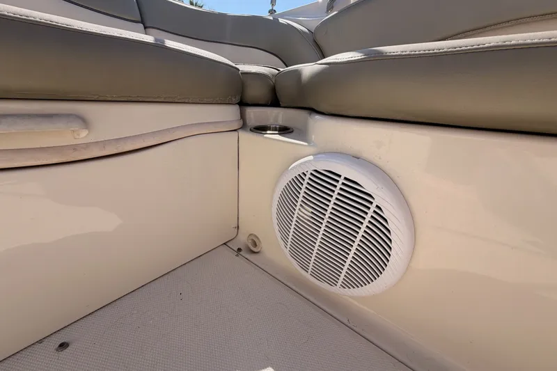 Slide: The Image of Interior of 2005 Sea Ray 240 Sundeck featuring seating and speaker. - 25