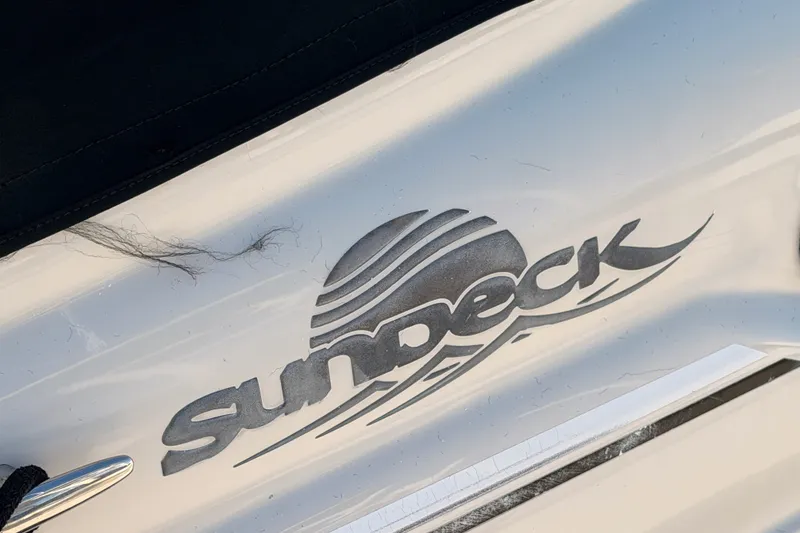 Slide: The Image of 2005 Sea Ray 240 Sundeck logo on boat exterior. - 39