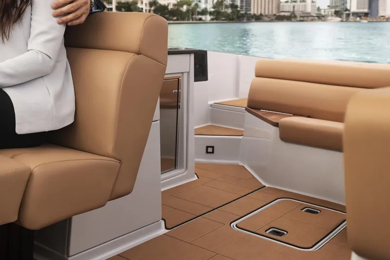 Slide: The Image of Manufacturer Provided Image: 2024 Aviara AV32 I/O boat interior with tan leather seating and waterfront view. - 9