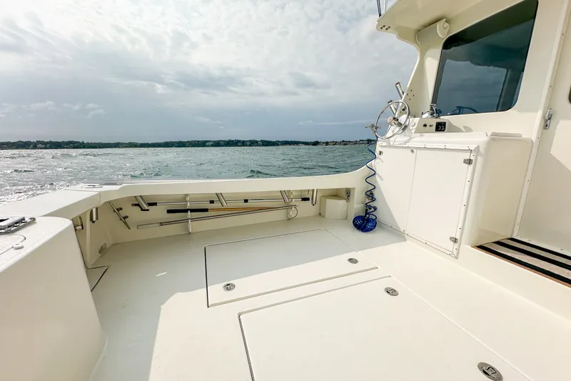 Slide: The Image of Open deck of a 2003 Northern Bay 36 boat with ocean view. - 22