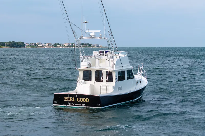 Slide: The Image of Northern Bay 36 boat from 2003 named "Reel Good" on the water near Falmouth, MA. - 68