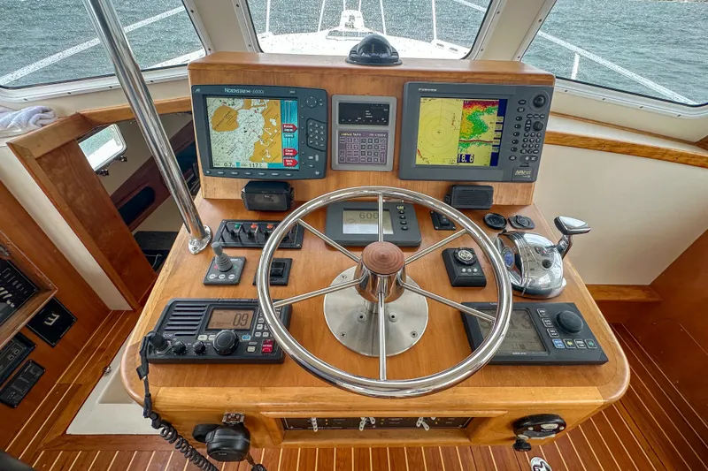 Slide: The Image of Helm of 2003 Northern Bay 36 boat with navigation equipment and steering wheel. - 41