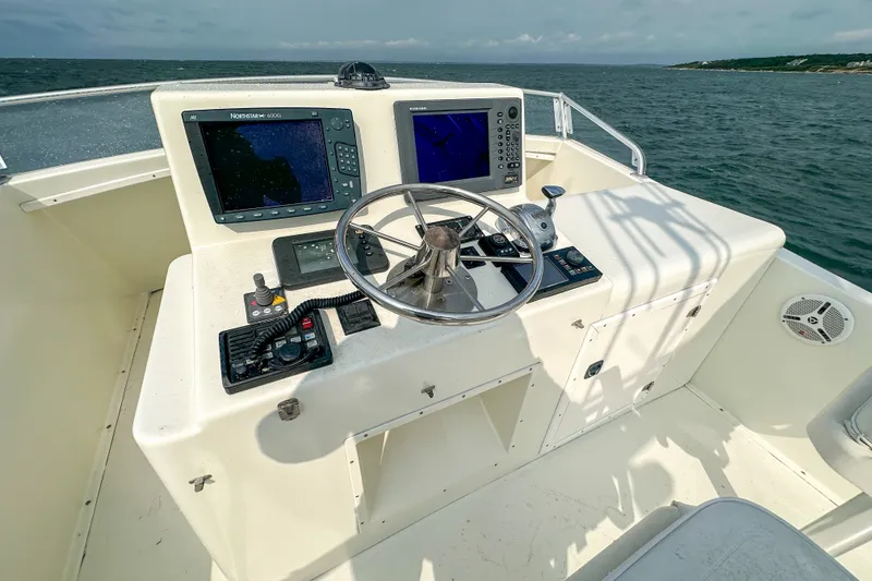 Slide: The Image of Helm of 2003 Northern Bay 36 boat with navigation equipment and steering wheel. - 26