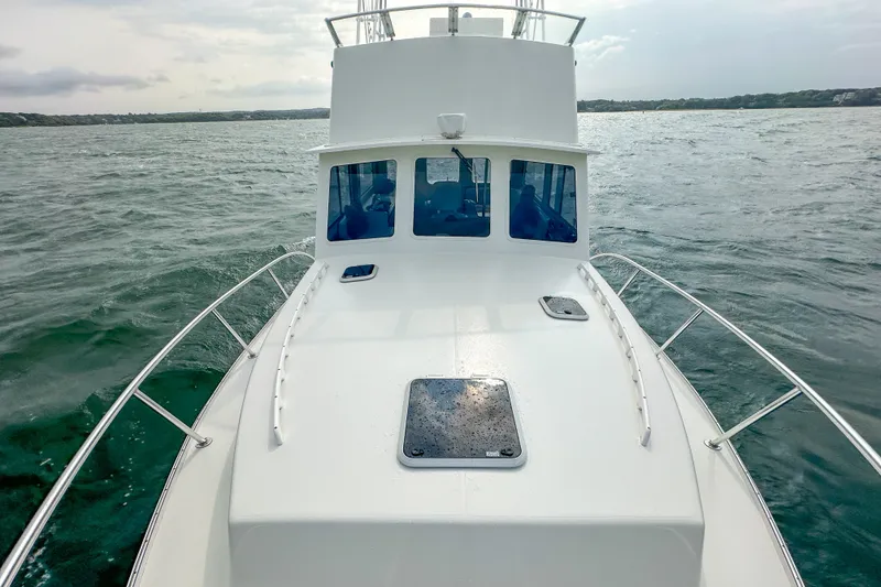 Slide: The Image of 2003 Northern Bay 36 boat cruising on open water with overcast sky. - 32