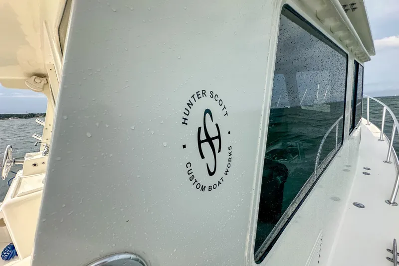 Slide: The Image of 2003 Northern Bay 36 boat with Hunter Scott Custom Boat Works logo on the side. - 31