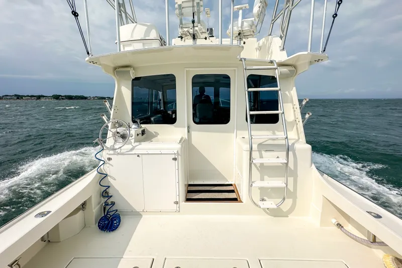 Slide: The Image of Northern Bay 36 boat, 2003 model, cruising on open water with clear skies. - 15