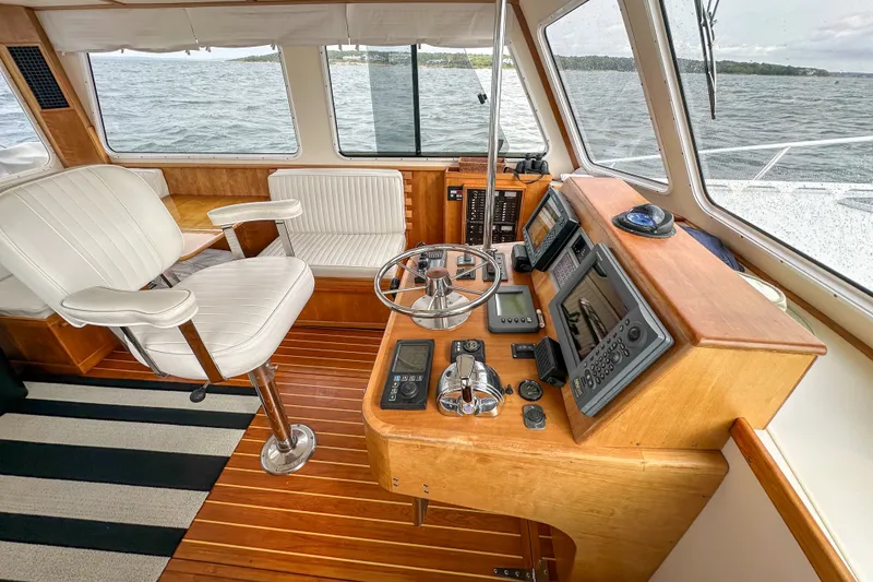 Slide: The Image of Interior of 2003 Northern Bay 36 boat with helm, controls, and seating. - 43