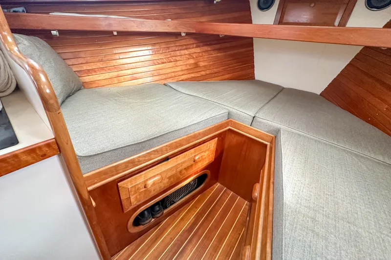 Slide: The Image of Cozy cabin interior of 2003 Northern Bay 36 boat with wooden finish and cushioned seating. - 53