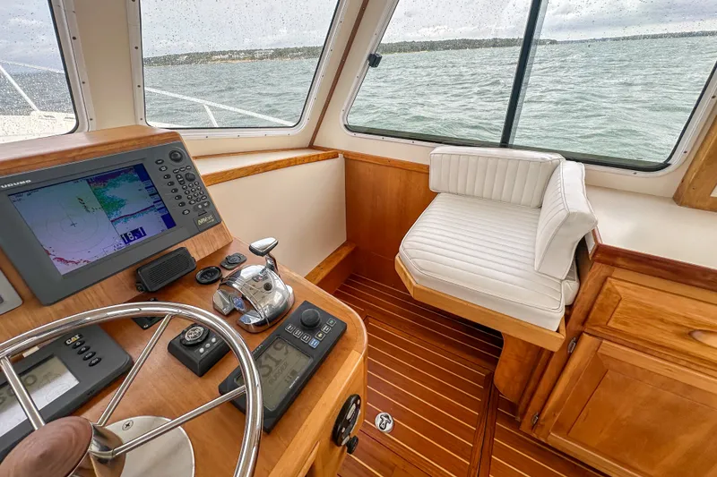 Slide: The Image of Interior of 2003 Northern Bay 36 boat with navigation equipment and seating. - 42