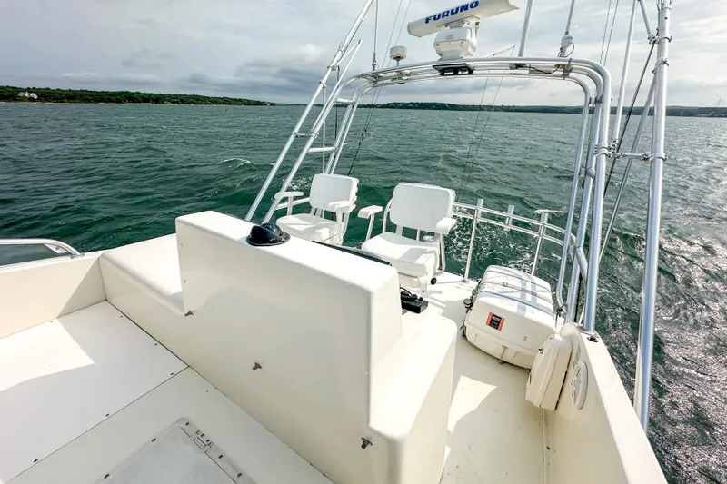 Slide: The Image of 2003 Northern Bay 36 boat with white seating and ocean view. - 28