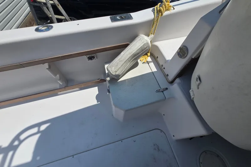 Slide: The Image of 1994 Grady-White Adventure 208 boat interior with fender and seating area. - 14