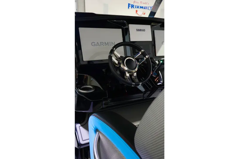 Slide: The Image of 2025 Sunsation 32 CCX boat dashboard with Garmin and Simrad displays. - 28