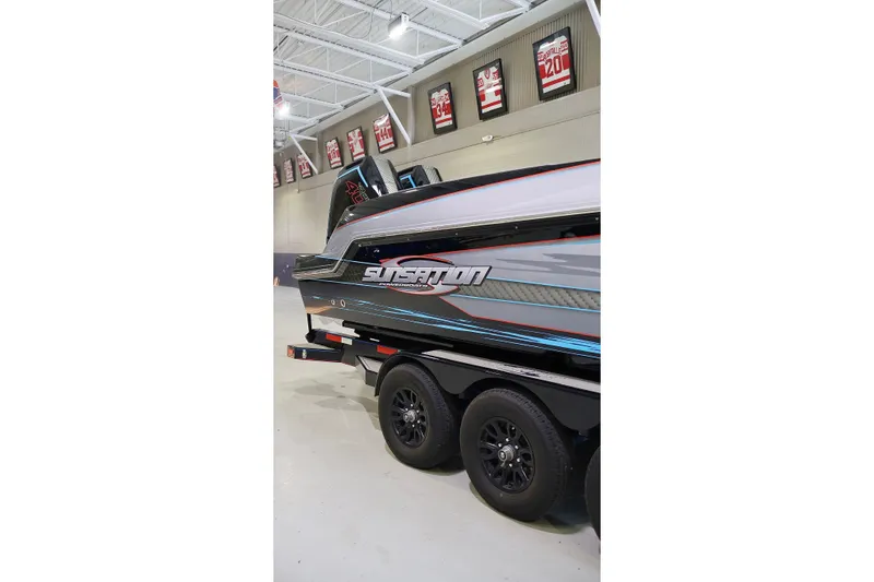 Slide: The Image of 2025 Sunsation 32 CCX boat on trailer in indoor showroom. - 6