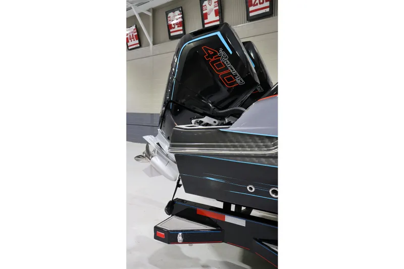 Slide: The Image of 2025 Sunsation 32 CCX boat with powerful Racing 400 engine displayed indoors. - 11