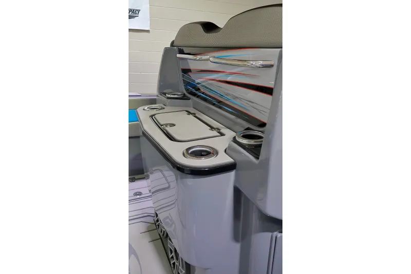 Slide: The Image of 2025 Sunsation 32 CCX boat interior with sleek design and cup holders. - 25